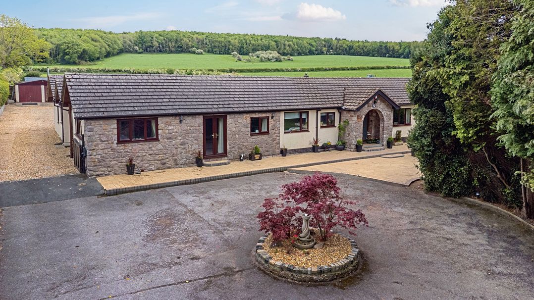 A house with garden and walkway at Brookway Lodge in Caerwys