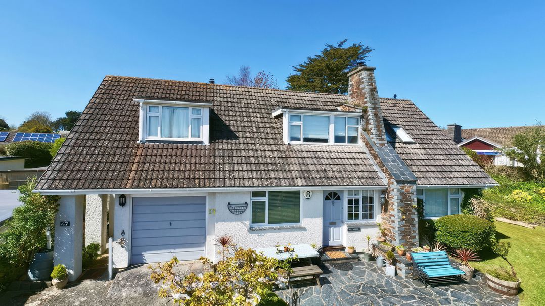 A house with windows and a chimney at Kilcarreg in Rock near Wadebridge