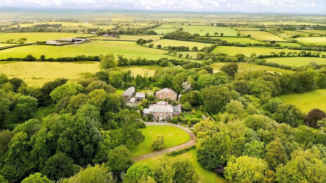 A house surrounded by gardens and fields at Parnacott in Holsworthy