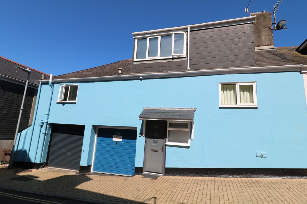 A house with blue exterior and garage door at 21 Above Town in Dartmouth
