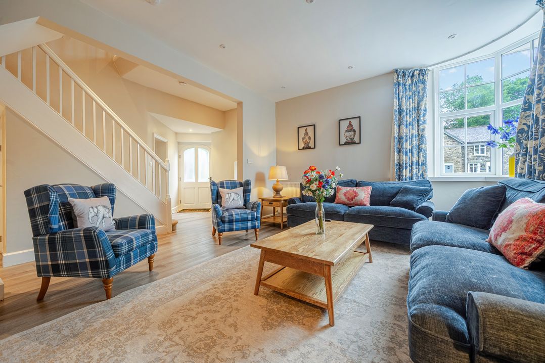 A living room with seating and a coffee table at Home Farmhouse at the Graythwaite Estate near Hawkshead