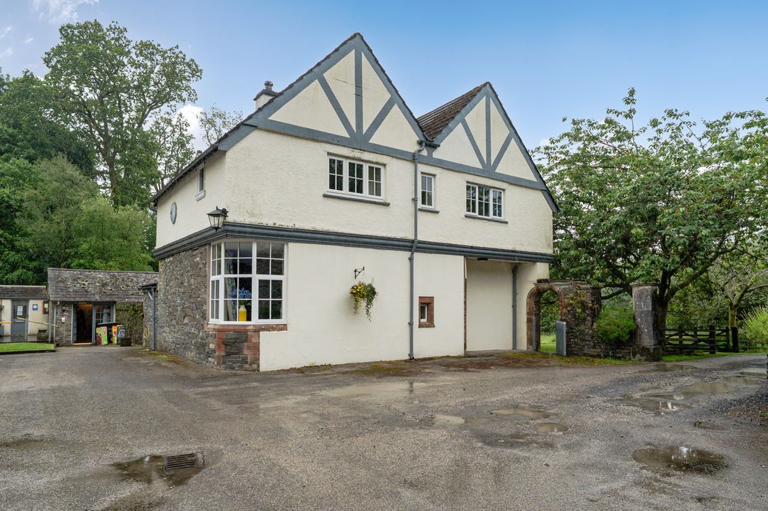 A house with windows and door at Home Farmhouse at the Graythwaite Estate near Hawkshead