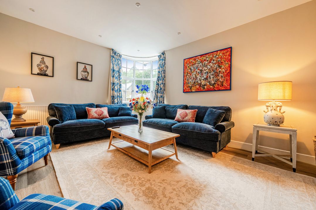 A living room with sofas and a coffee table at Home Farmhouse at the Graythwaite Estate near Hawkshead