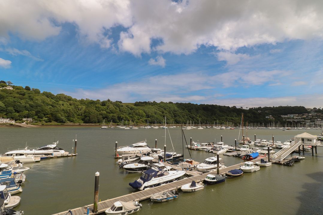 A marina with boats and a dock at 22 Dart Marina Dartmouth