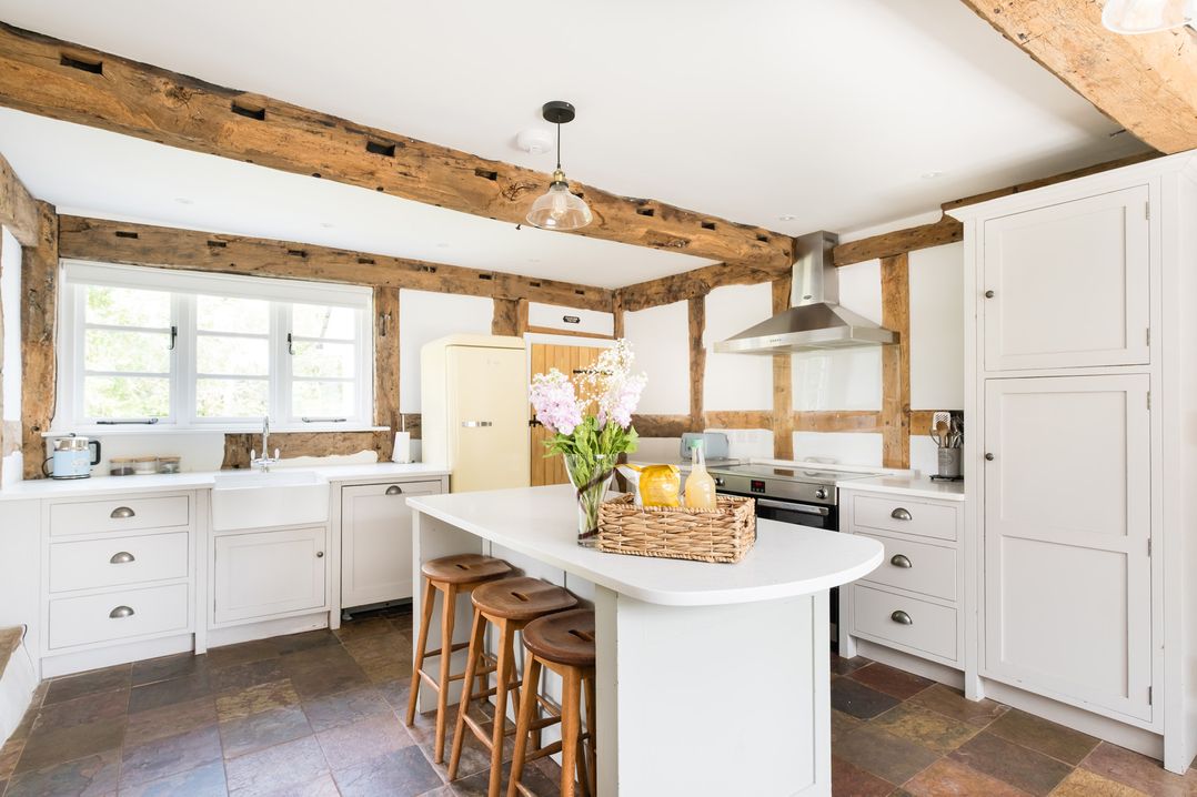 A kitchen with a refrigerator and stove at Henhouse Farm in Bodenham