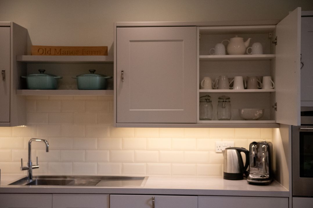 A kitchen with plumbing fixtures and storage at Old Manor Farm in Low Ham near Langport