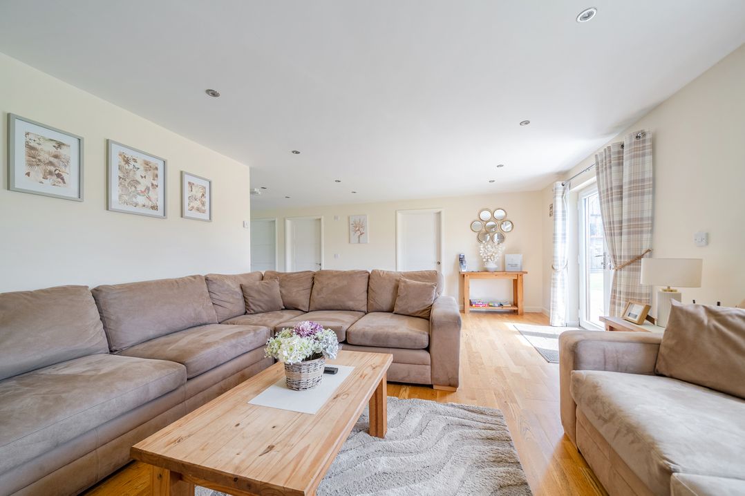 A living room with a sofa and coffee table at Aspen Lodge Near Brigg