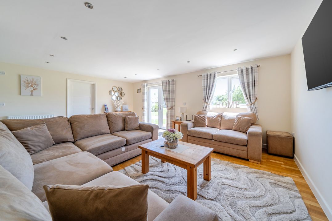 A living room with a sofa and coffee table at Aspen Lodge Near Brigg