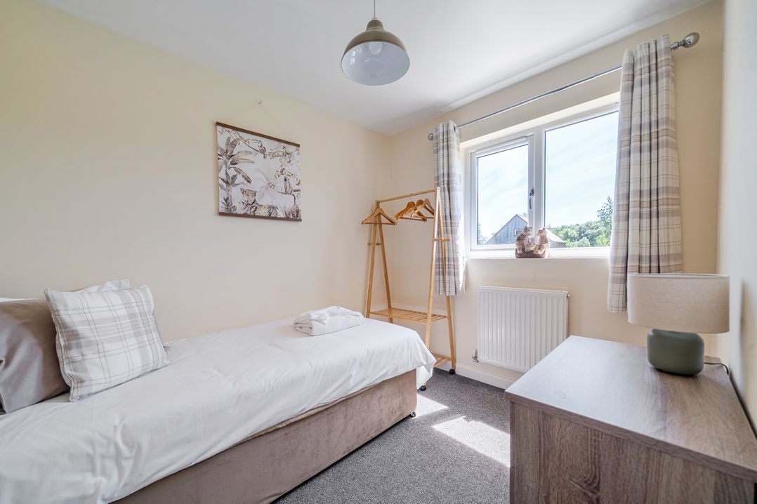 A bedroom with a bed and a window at Aspen Lodge near Brigg