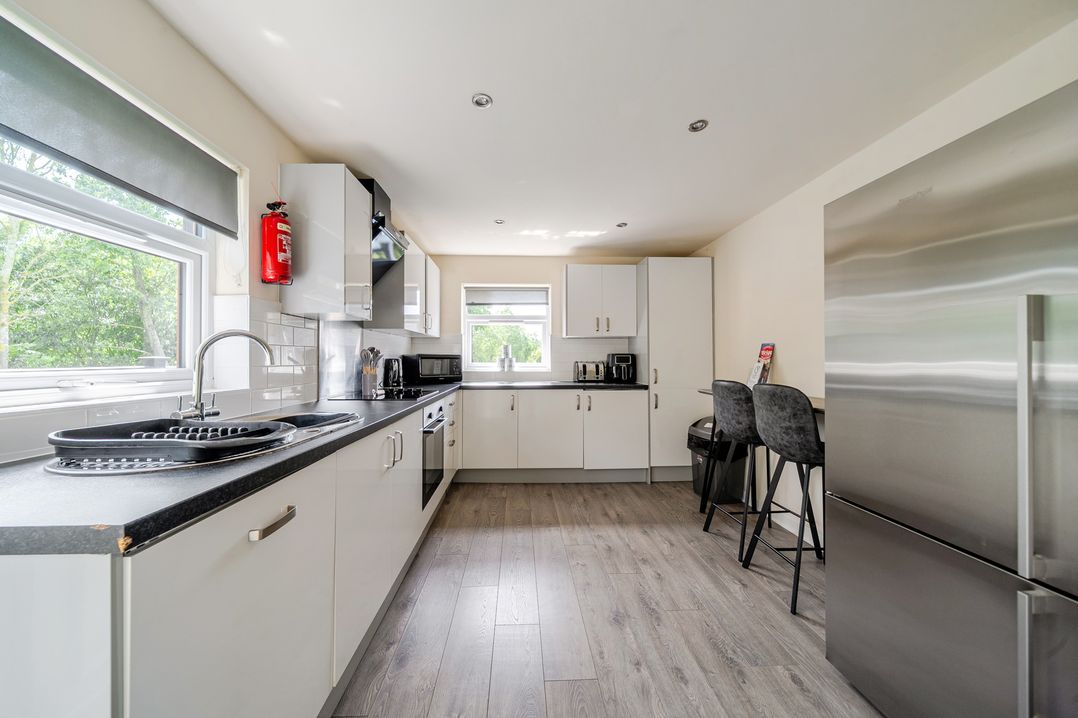 A kitchen with appliances and seating at James Ville Marina Lodge 13, Brigg