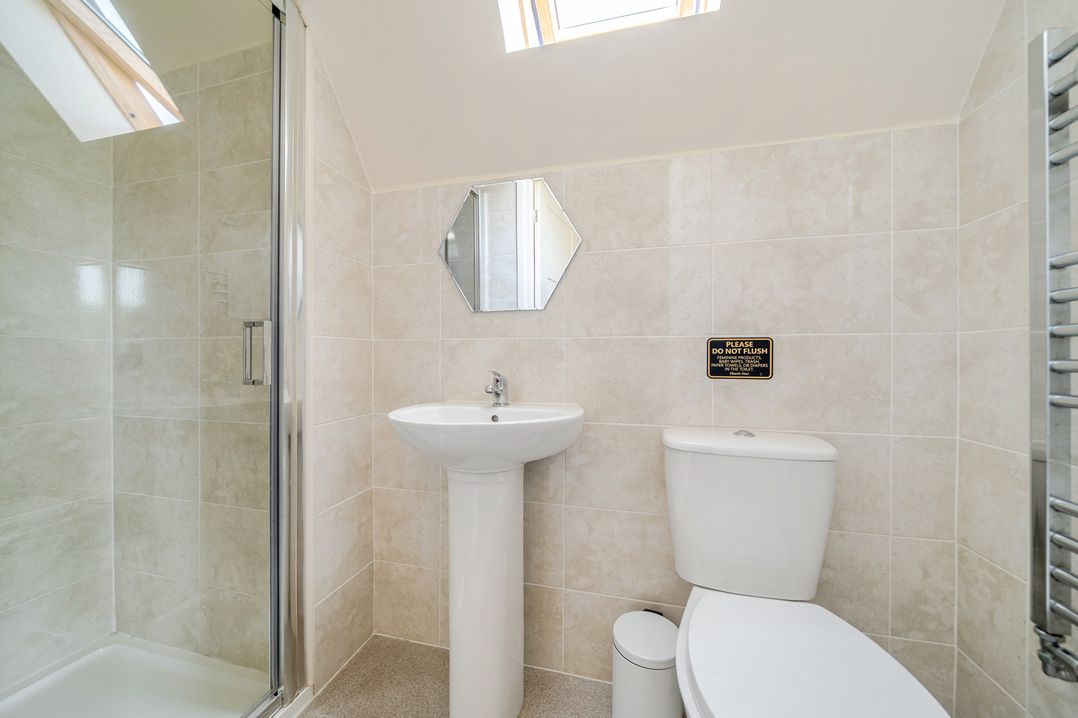 A bathroom with a shower, sink, and toilet at James Ville Marina Lodge 13 in Brigg