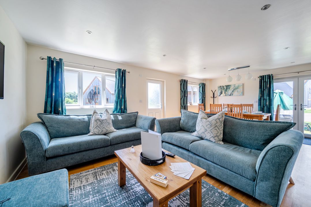 A living room with a sofa and coffee table at James Ville Marina Lodge 22 in Brigg