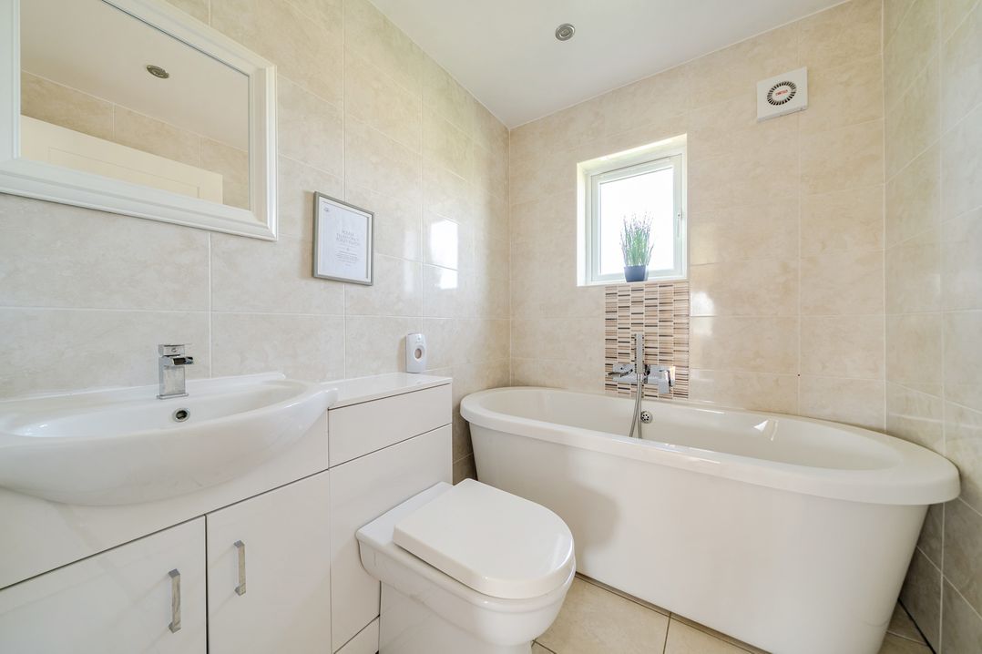 A bathroom with a bath tub and sink at James Ville Marina Lodge 22 in Brigg