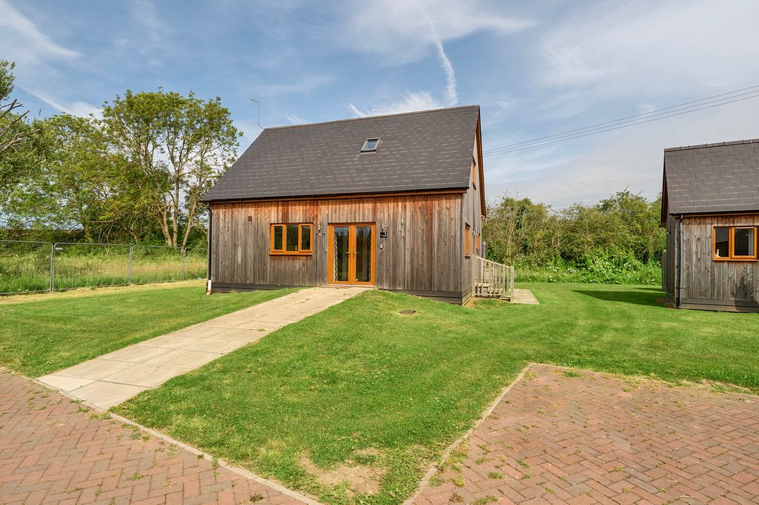 A house with a pathway and grass at Poker Lodge Near Brigg