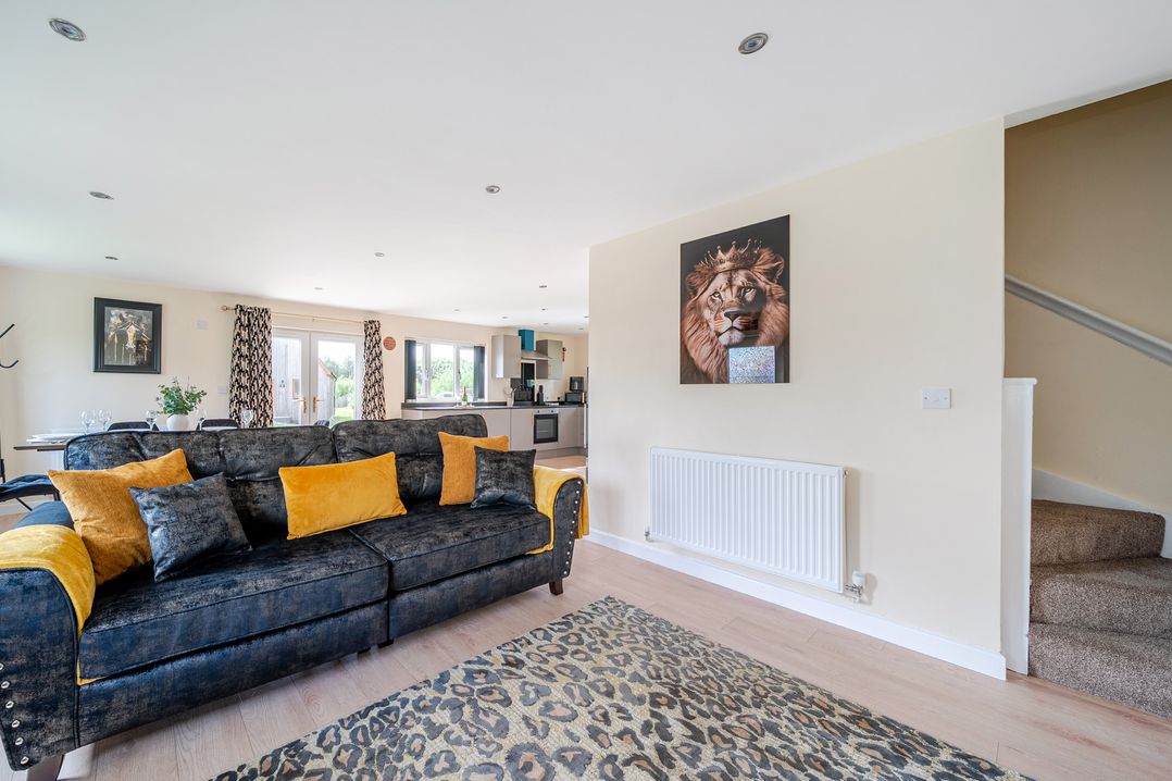 A living room with a sofa and rug at Poker Lodge near Brigg