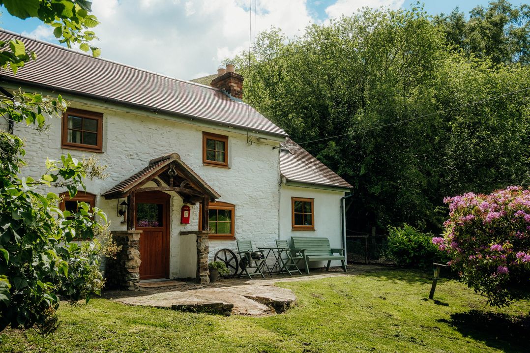 A house with a porch and garden at The Wilderness in Stiperstones