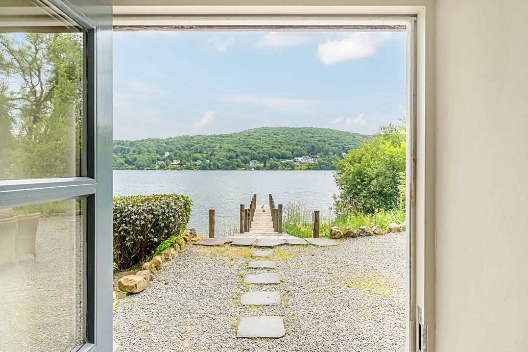A view of a dock leading to water at Hammerhole at the Graythwaite Estate near Hawkshead