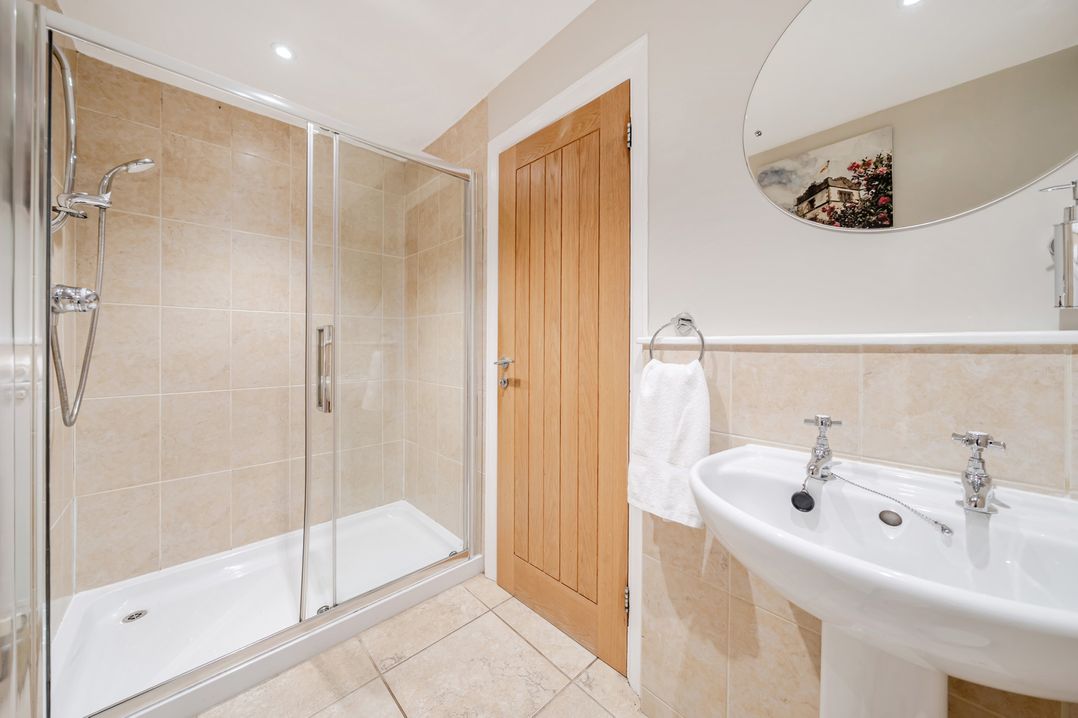 A bathroom with a shower and sink at Hammerhole at the Graythwaite Estate near Hawkshead