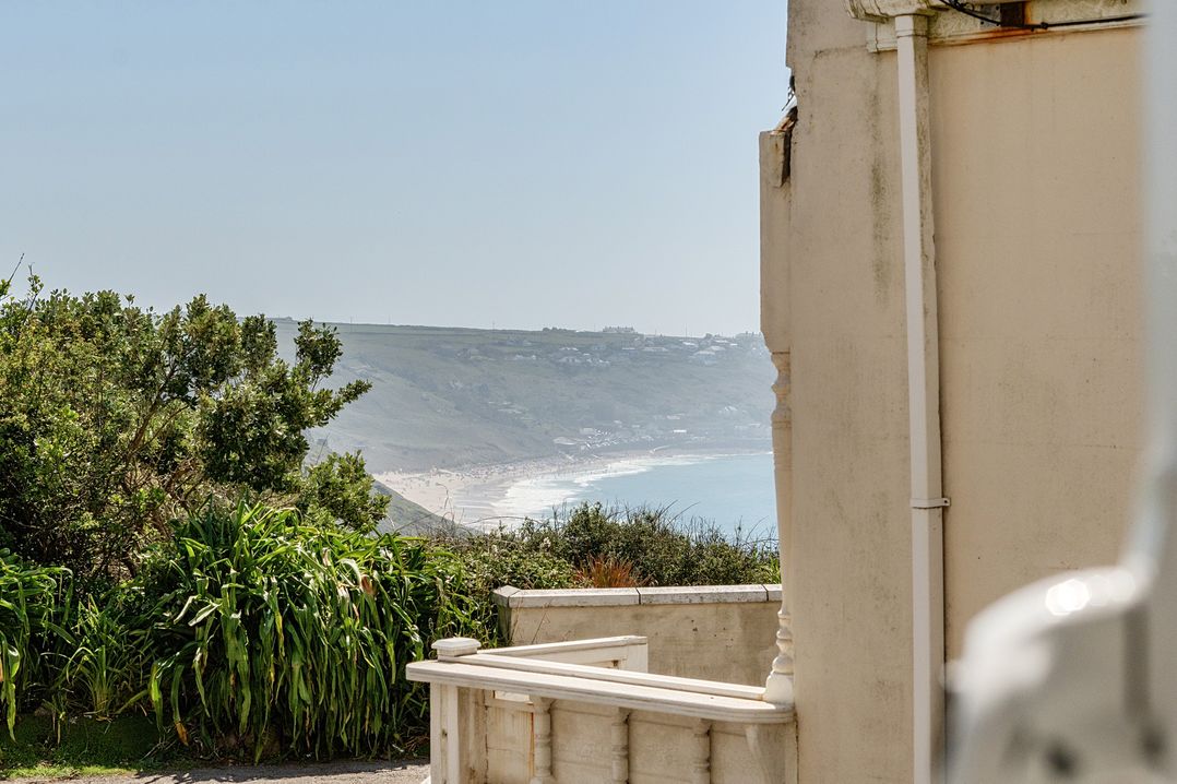 A view of the ocean and beach from a property at Brook House in Sennen Cove near St Just