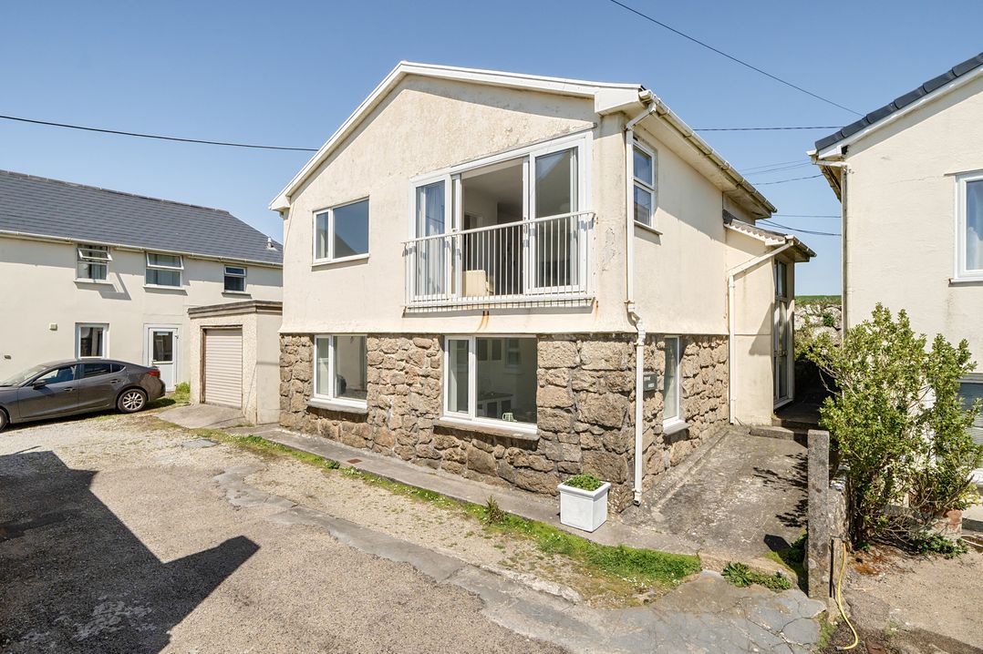 A house with a garage and car at Brook House Sennen Cove near St Just