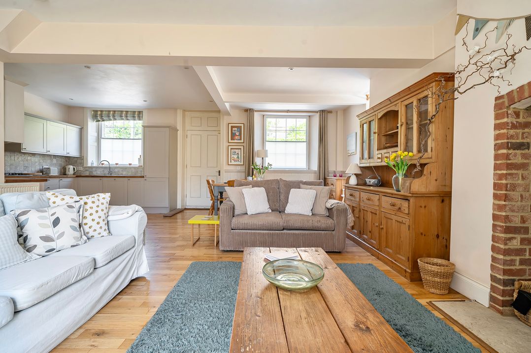 A living room with a sofa and coffee table at East Wing in Crewkerne