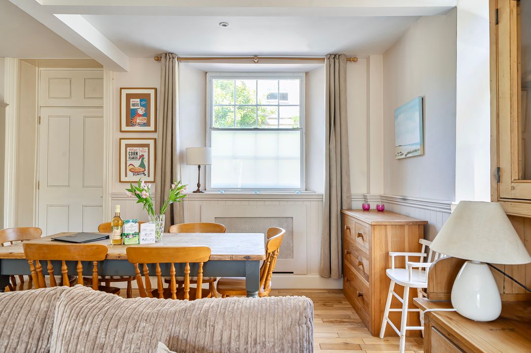 A dining room with a table and chairs at East Wing in Crewkerne