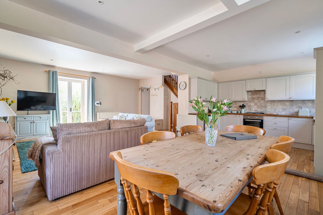 A dining room with a table and chairs at East Wing in Crewkerne