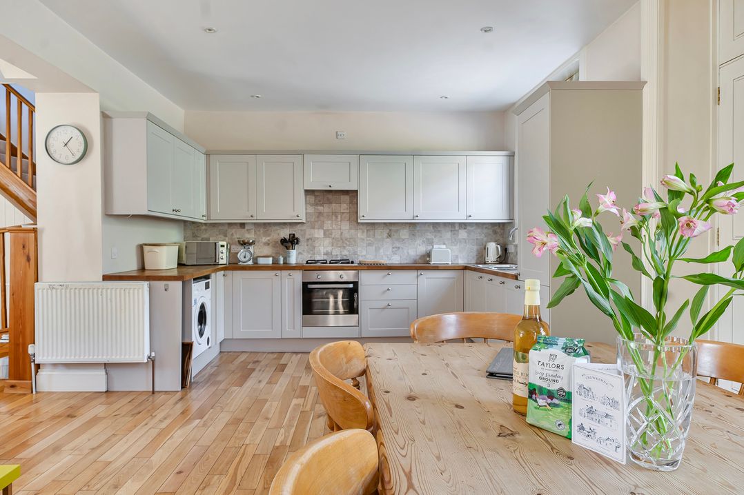 A kitchen with a table and chairs at East Wing in Crewkerne