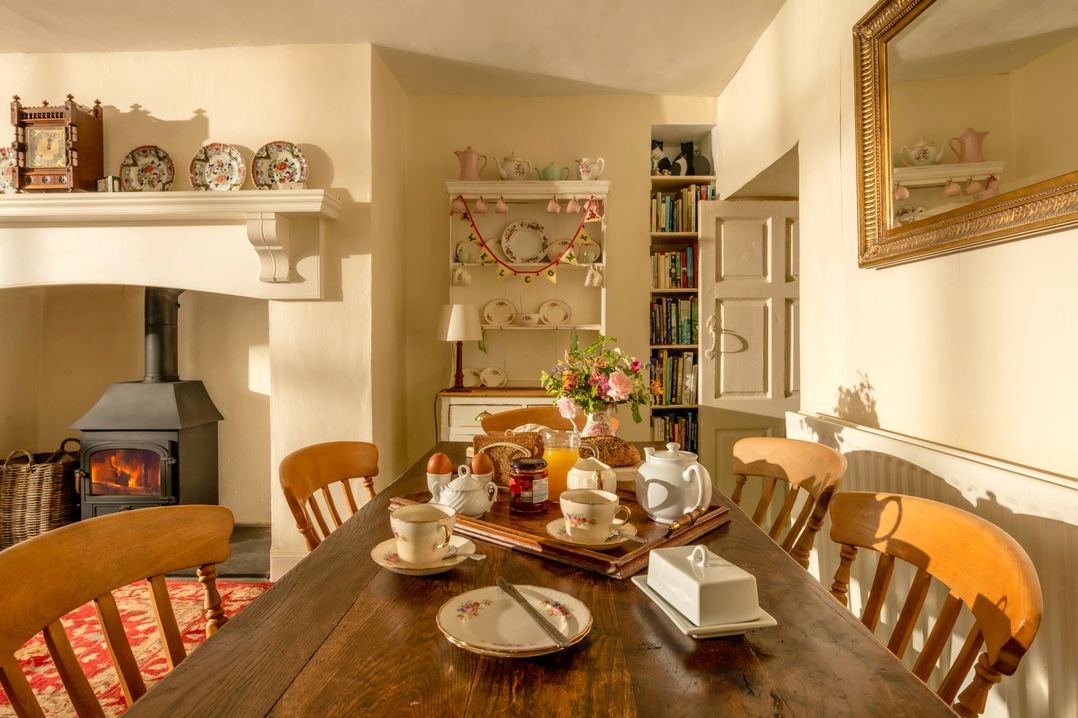 A dining room with a table set for tea at Parnacott in Holsworthy
