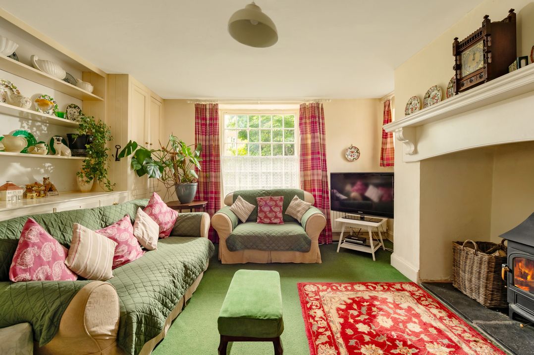 A living room with a sofa and television at Parnacott in Holsworthy