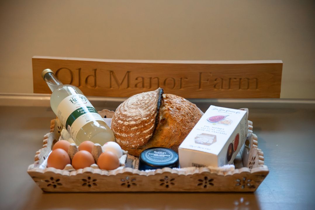 A tray with bread, eggs, drink and crackers at Old Manor Farm in Low Ham near Langport