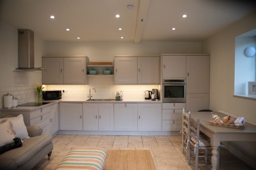 A kitchen with cabinets and appliances at The End in Low Ham near Langport