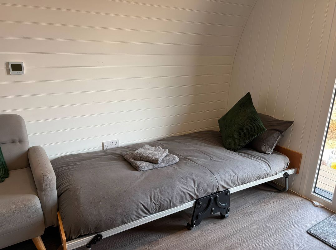 A bed with a pillow and towel in a bedroom at Natures Nest near Rillington