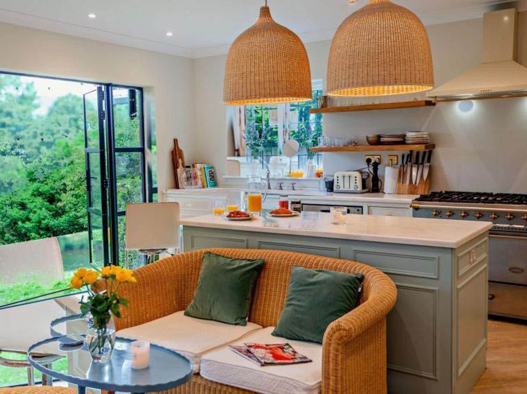 A kitchen with a countertop and seating area at Luxurious 5 Bedroom House in Cookham near Marlow