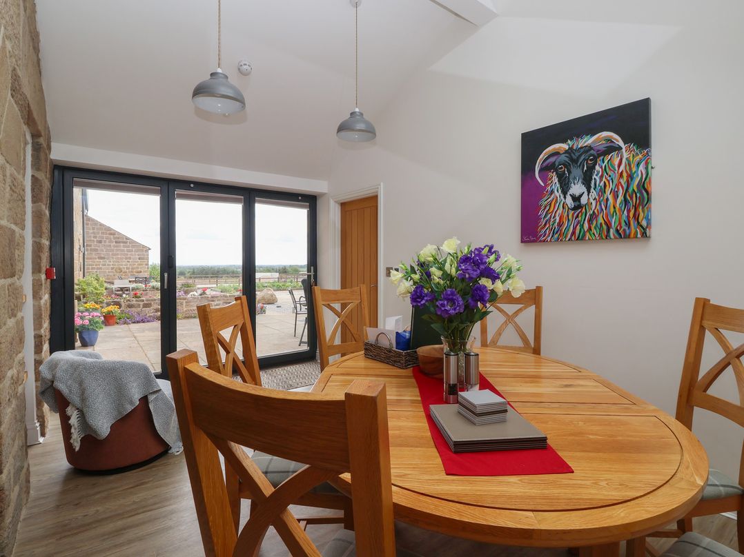 A dining room with a table and chairs at Shepherd's Crook in Follifoot near Spofforth