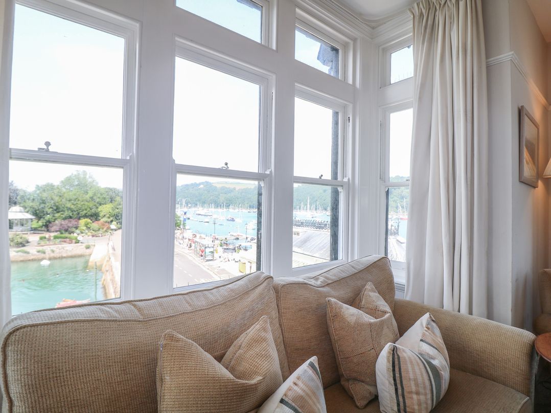 A living room with a view of the harbor at 2 York House in Dartmouth