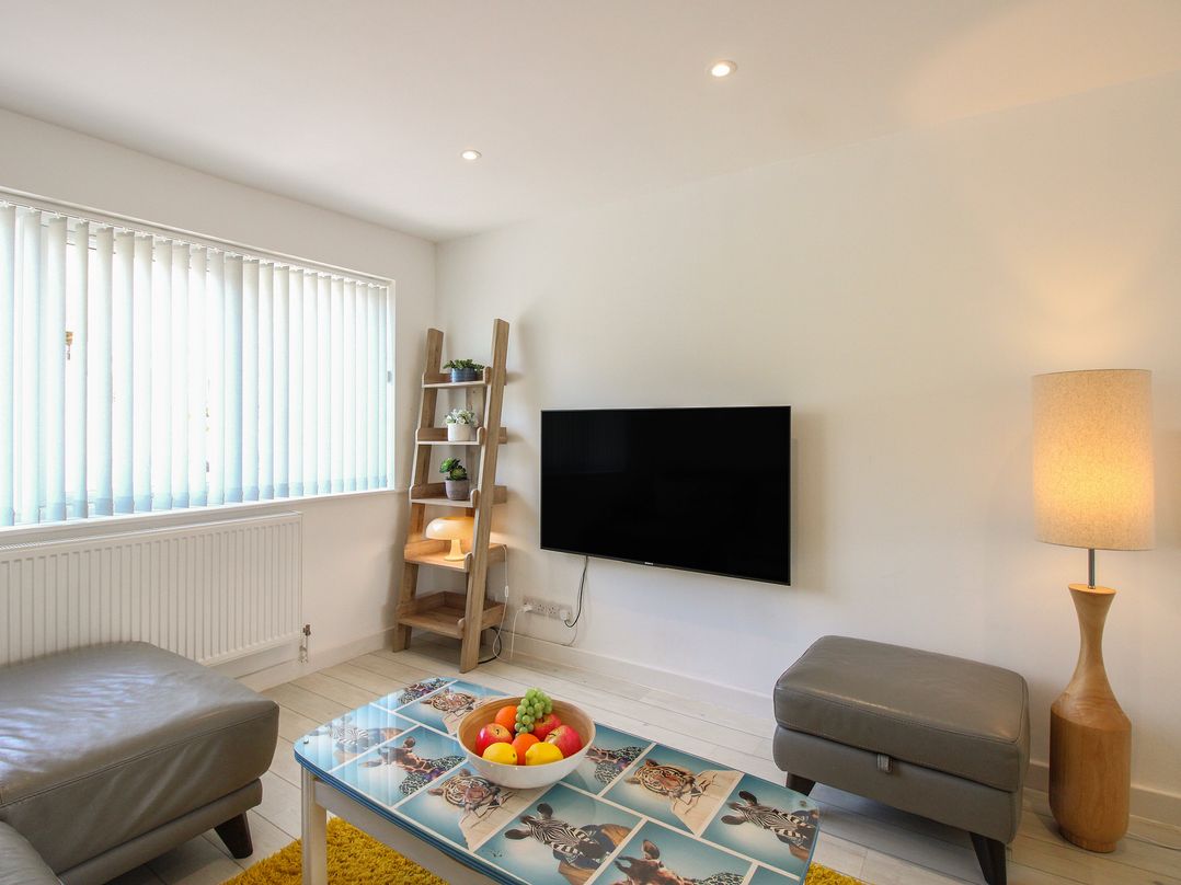 A living room with a television and a coffee table at Little Starboard in Kingsbridge