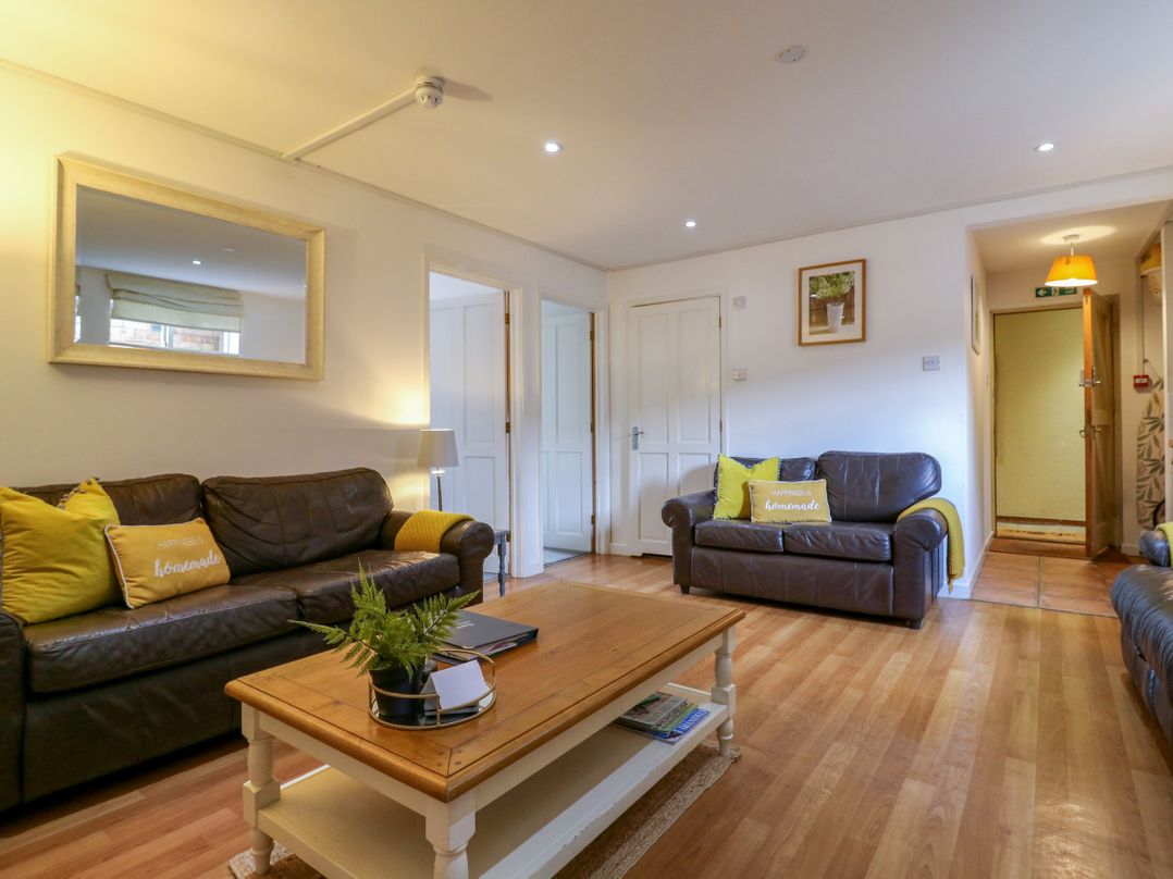 A living room with sofas and a coffee table at BB House Roxhill Manor Farm
