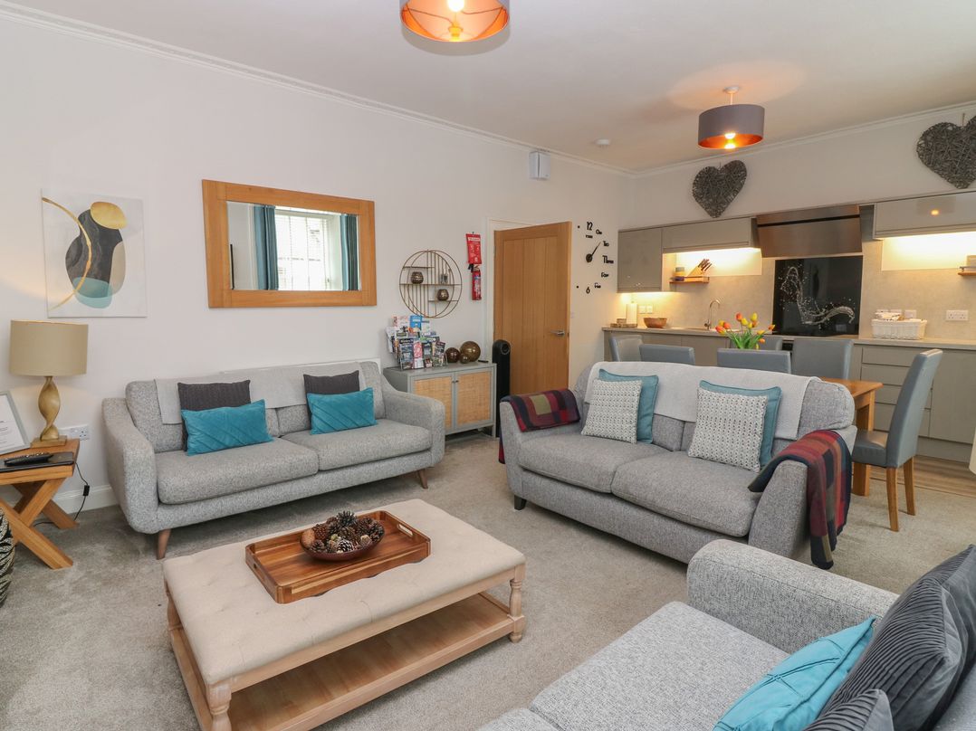 A living room with sofas and a coffee table at 2 Abbey Row in Kelso