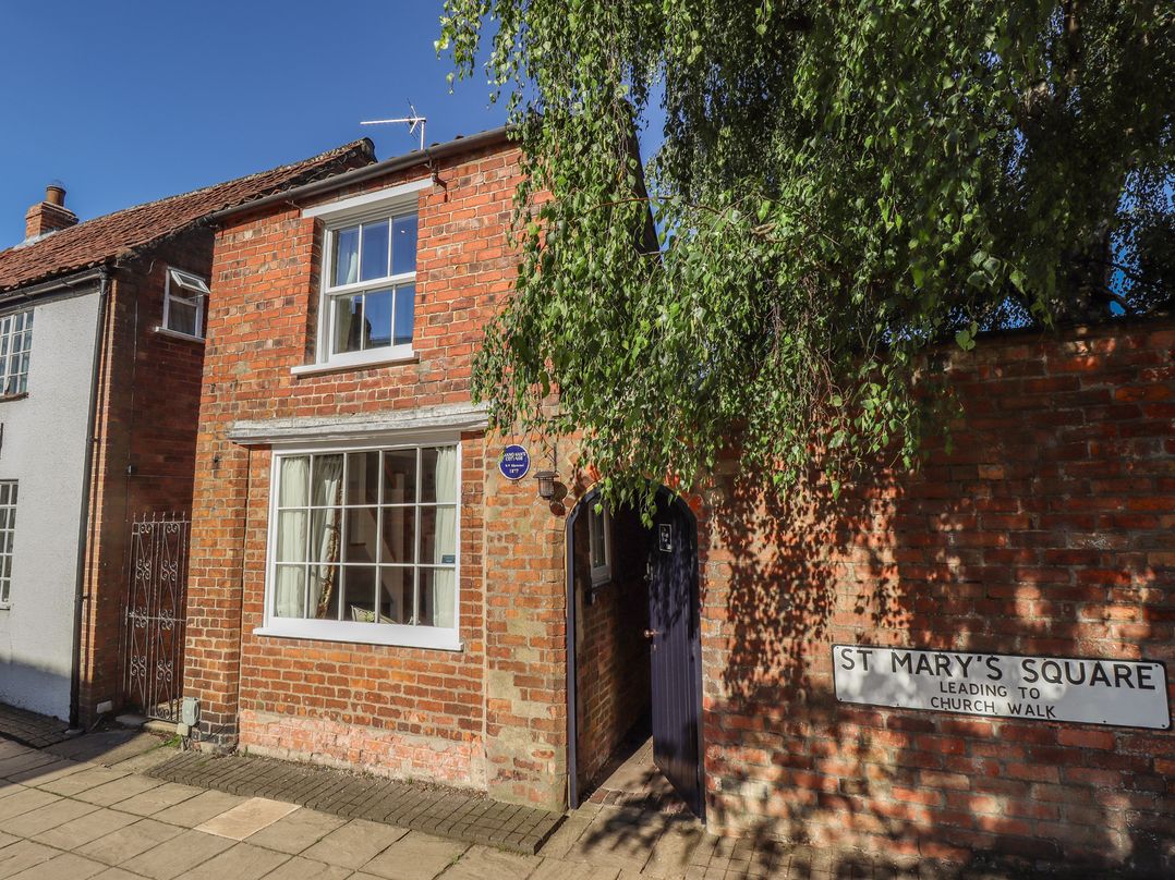 A brick building with a sign at Hangmans cottage Horncastle