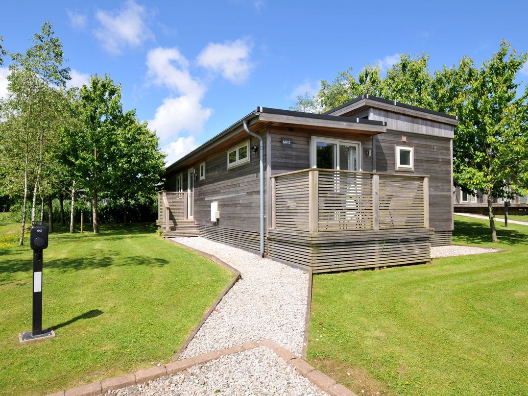 A house with a deck and garden at 12 Meadow Retreat in Dobwalls
