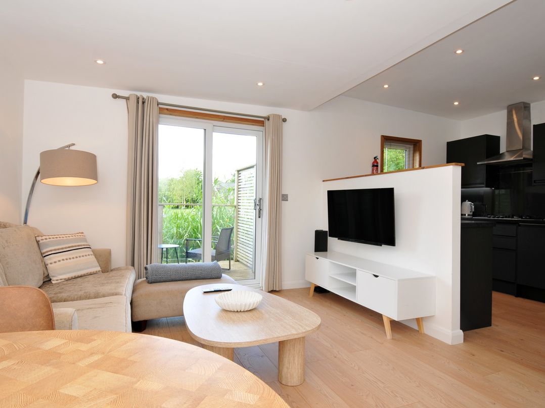 A living room with a sofa and television at 12 Meadow Retreat in Dobwalls