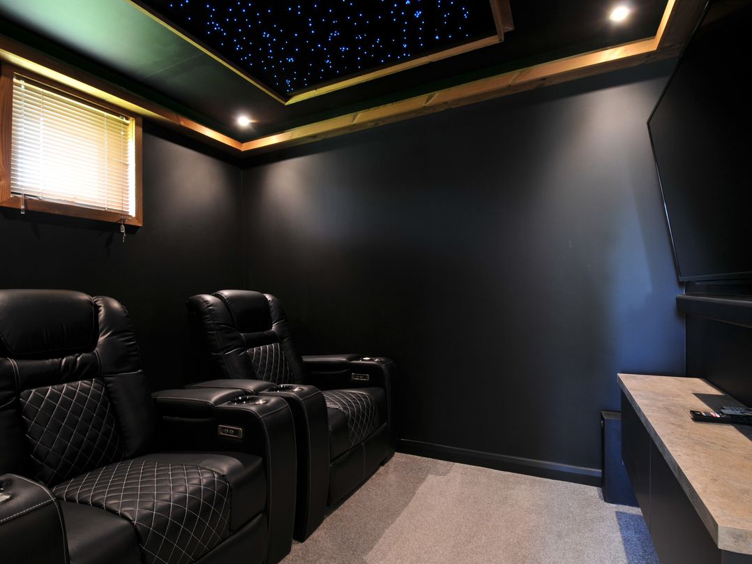 A home theater with seating and a television at 12 Meadow Retreat, Dobwalls