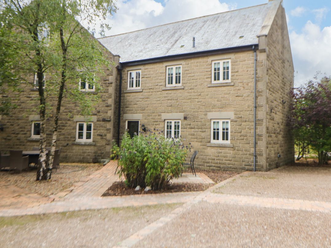 A building with windows and a pathway at Hartington in Darley Moor near Two Dales