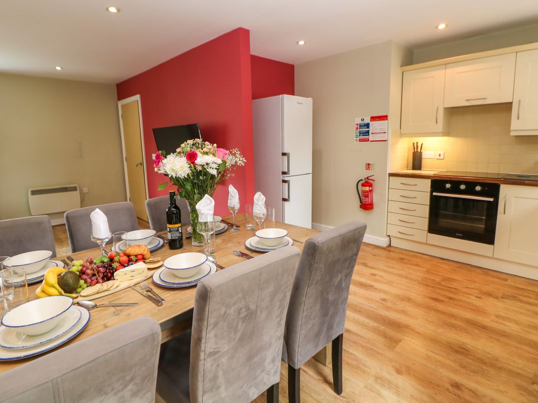 A dining room with a table set for dinner at Hartington in Darley Moor near Two Dales