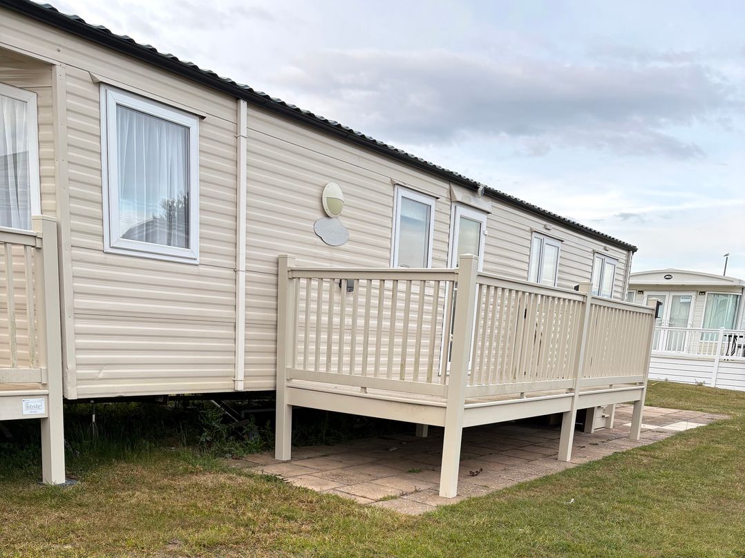 A caravan with a deck at Caravan 607 in Clacton-On-Sea