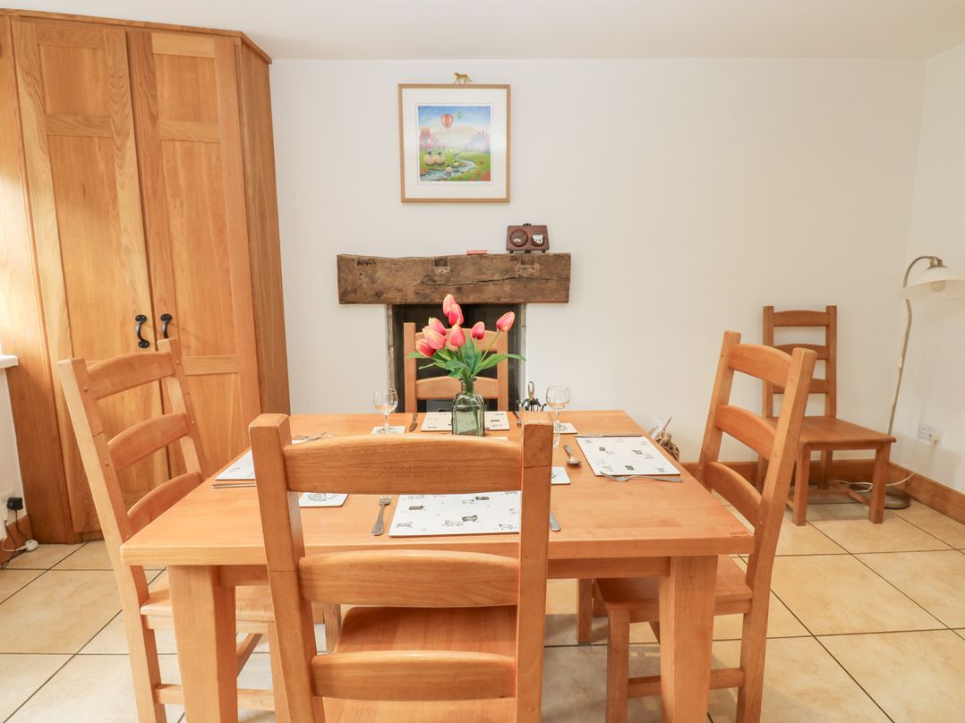 A dining room with a table and chairs at Bridge House