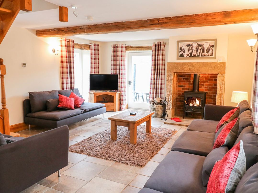A living room with sofas and a coffee table at The Barn in Wirksworth