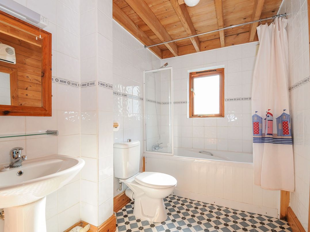 A bathroom with a sink, toilet, shower, and bathtub at Eden in St Breward