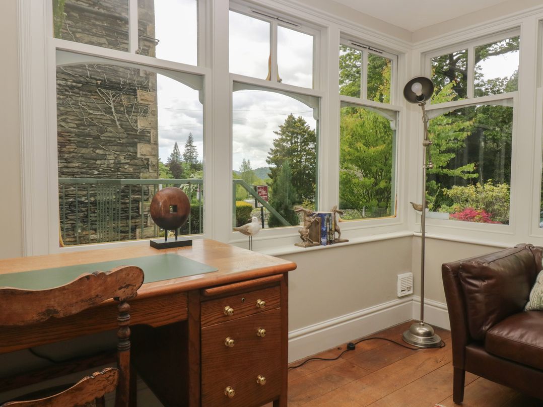 A study with a desk and window view at The Boundary in Windermere